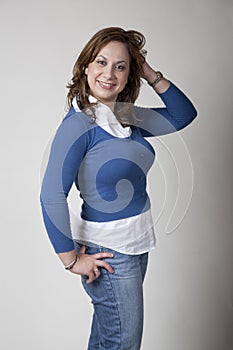 Woman in Blue Cardigan Playing with her Hair