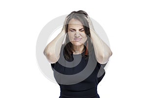 A woman in a blue dress grimaces and holds her head. Migraine and malaise. Isolated on white background. Close-up