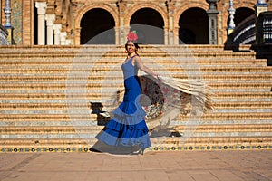 The woman with the blue dress and the red bow dancing photo
