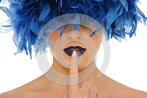 Woman with blue feathers lips and closed eyes