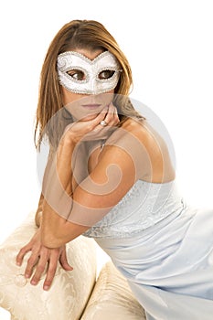 Woman in a blue formal hand under chin mask