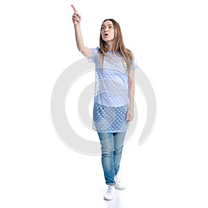 Woman in blue jeans standing hands up smiling happiness wow surprise showing pointing