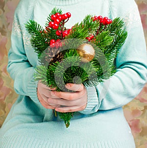 Woman in blue knitted sweater with a bouquet