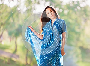 Woman in blue polka-dot dress