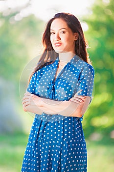 Woman in blue polka-dot dress