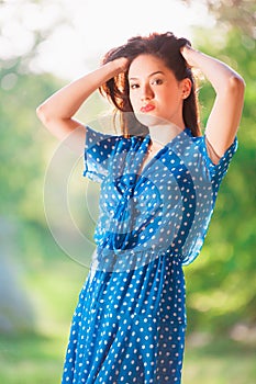 Woman in blue polka-dot dress