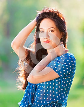 Woman in blue polka-dot dress