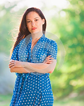 Woman in blue polka-dot dress