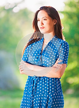 Woman in blue polka-dot dress