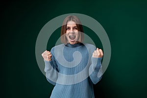 Woman in Blue Sweater Making Funny Face