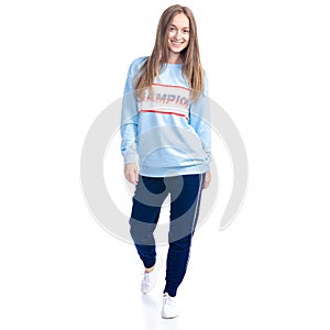 Woman in blue sweatpants sport style casual goes walking smiling