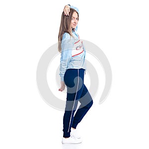 Woman in blue sweatpants sport style casual standing looking smiling