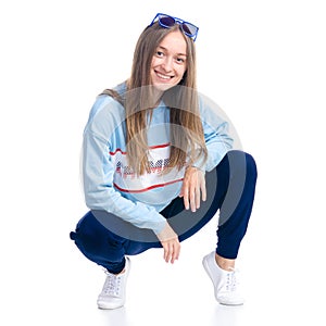 Woman in blue sweatpants with sunglasses sport style casual sat down smiling happiness