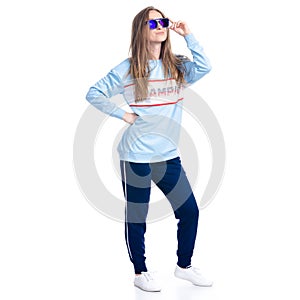 Woman in blue sweatpants with sunglasses sport style casual standing smiling happiness