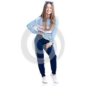Woman in blue sweatpants with sunglasses sport style casual standing smiling happiness