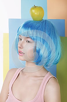 Woman in Blue Wig with Apple on her Head