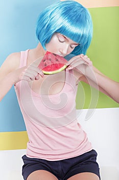 Woman in Blue Wig Holding Slice of Watermelon