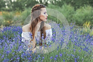 Woman among the blue wildflowers.