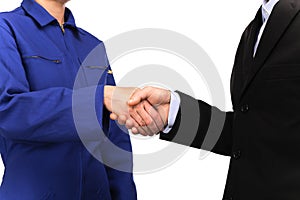 Woman in blue work uniform and a man dressed in suit shaking hands