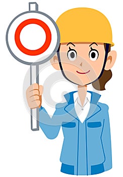 Woman in blue workwear wearing a helmet giving a correct answer