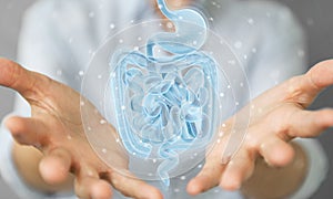 Woman using digital x-ray of human intestine holographic scan projection 3D rendering photo