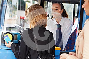 Woman Boarding Bus And Using Pass