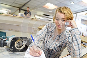 Woman boat constructor on phone