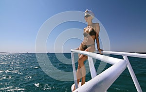 Woman on a boat, over the sea