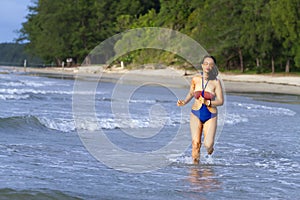 Woman body big with swimsuit walkin morning at beach