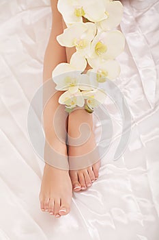 Woman Body Care. Close Up Of Long Female Legs With Perfect Smooth Soft Skin, Pedicure And Beautiful Hands With Natural Manicure, H