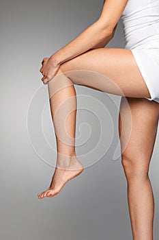 Woman Body. Close Up Of Beautiful Female Legs With Pain In Knee