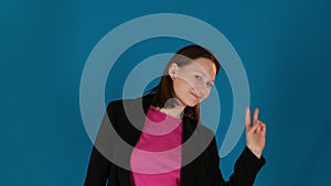 Woman body demonstrates rhythmic sway on blue background