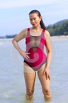 Woman body large with bikini red on beach