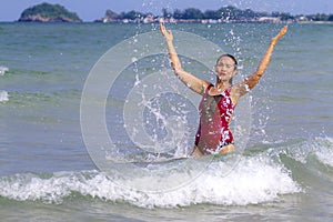 Woman body large enjoy with bikini  crimson on beach