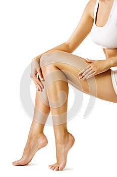 Woman Body Legs Beauty, Model Sitting on White, touch Leg Skin