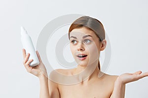 woman body lotion rejuvenation cosmetics Gray background
