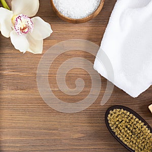 Woman body and skincare, massage and bath products, sea salt in bowl, white towel, flower, cacus brush for dry massage