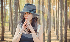 Woman in Bohemian style at forest