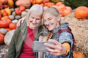 Woman bonding and embracing her senior mother