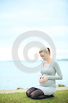 Woman bonding with unborn child