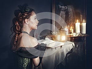 Woman with book in retro dress and ghost in the mirror