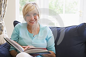 Woman with a book smiling