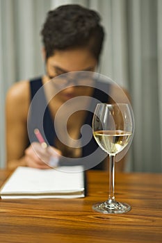 Woman with book and wine