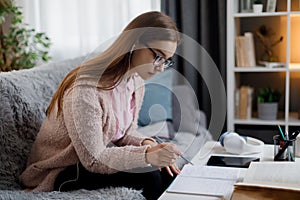 Woman with books and notes studying
