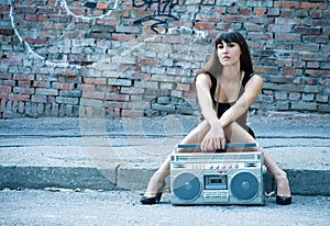 Woman with boom box on the street