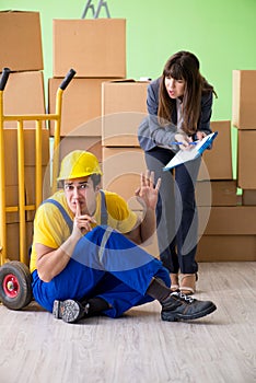 The woman boss and man contractor working with boxes delivery