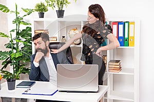 Woman boss touching and harassing man secretary working in office, harassment