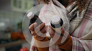 Woman with bottles of remedy for her illness