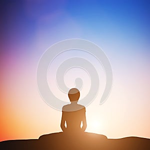 Woman in bound angle yoga pose meditating at sunset. Zen