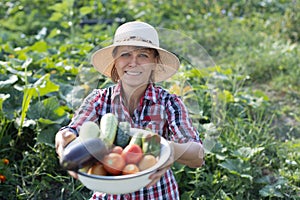 Woman with a bowl of vegetables